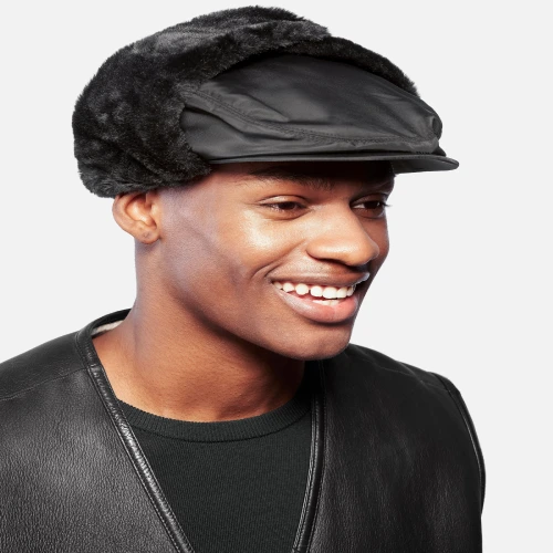 Model wearing Kangol aviator black hat side profile street style