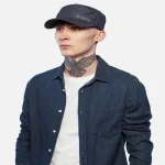 Side view of model wearing Kangol Hat Denim FlexFit Army Cap