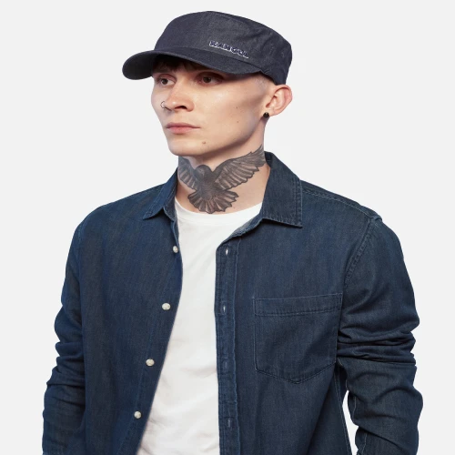 Side view of model wearing Kangol Hat Denim FlexFit Army Cap