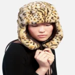 Side view of Kangol Hat Leopard Trapper showing ear flap and profile shape